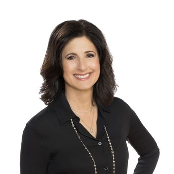 Portrait of Dina Sierra Smith, REALTOR®.